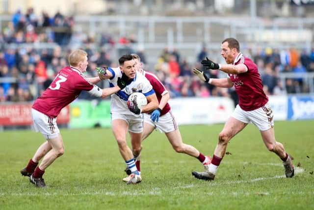 St. Vincent's Shane Carthy and Slaughtneil's Christopher Bradley, Keelan Feeney, and Patsy Bradley.
(Picture: Philip Magowan / PressEye)