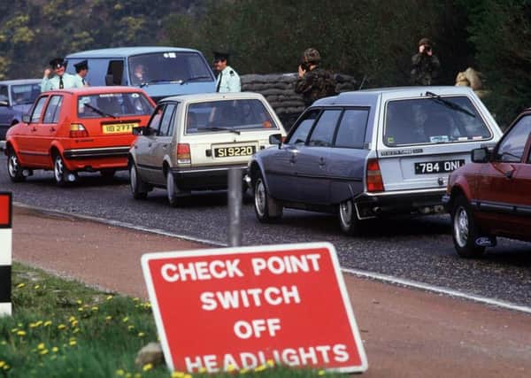 RUC and army checking cars at the border in the 1980s. (Pacemaker)