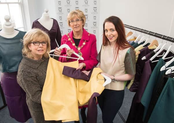 The Mayor Alderman Hilary McClintock and Inner City Trust Chief Executive Helen Quigley who had a sneak preview of some of Emma Curtis's collection of clothes which she is taking to London Fashion Week on Friday. Emma is a resident of the Fashion and Textile Design Centre in Derry's Shipquay Street which aims to promote young designers . Picture Martin McKeown. Inpresspics.com. 13.02.17