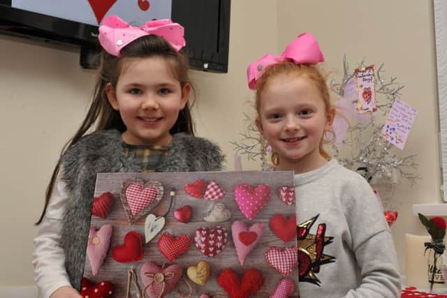 Friends Madison Houston (8) and Chantelle McCauley (8) were at the Farland Way community centre's Valentines Day childrens party. DER0717GS003