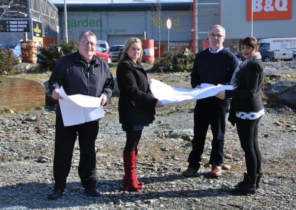Sinn FÃ©in Councillor Tony Hassan, Councillor Sandra Duffy, Raymond McCartney and Elisha McCallion at the site of the proposed new retail outlet at the former B&Q site on the Buncrana Road.