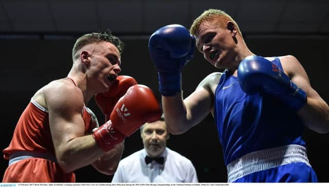 Brett McGinty, right, of Oakleaf, exchanges punches with Peter Carr of Crumlin during their 69kg bout during the 2016 IABA Elite Boxing Championships at the National Stadium in Dublin.