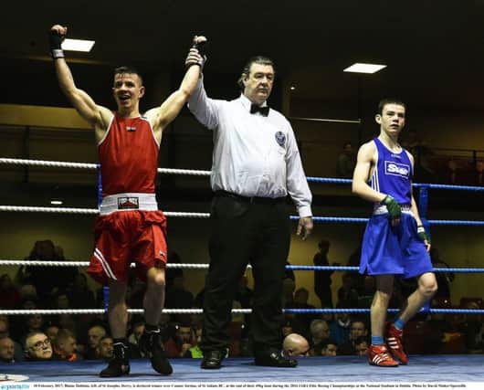 Blaine Dobbins, left, of St Joseph's, Derry, is declared winner over Connor Jordan, of St Aidan's BC, at the end of their 49kg bout during the 2016 IABA Elite Boxing Championships at the National Stadium in Dublin. Photo by David Maher/Sportsfile