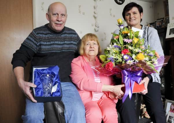 Ann Marie McMenamin, Adult Placement Coordinator for the Western Trust, thanks Limavady couple Eddie and Josie Reid for opening up their home for the past 25 years and providing respite care for children and adults with learning disabilities.