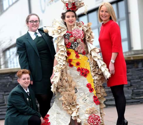 Alison Mitchell, Customer Services Manager, Bank of Ireland UK Strand Road, visiting student designers Jodie Cox and Hannah Kehoe, from St Cecilias College, Derry, after they secured a place in the Bank of Ireland Junk Kouture Northern Regional Final which takes place in the Millenium Forum on March 6.. Modelling the outfit Paper Dreams' is fellow student Laura Glowicka. Photo Lorcan Doherty Photography