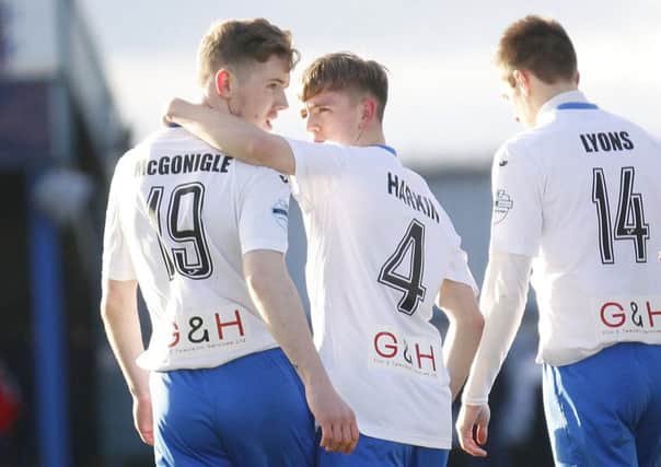 Ciaron Harkin (centre) has settled into life at Coleraine very nicely. Picture by Peter Morrison/PressEye