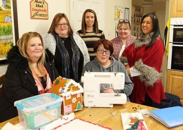 Martina Forrest of the Northern Ireland Housing Executive (centre rear) pictured with Shiela McWilliams and some of the regulars at the Coolessan community Association craft class.