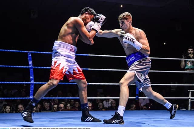 Connor Coyle, right, lands a right hook against Miguel Aguillar.
