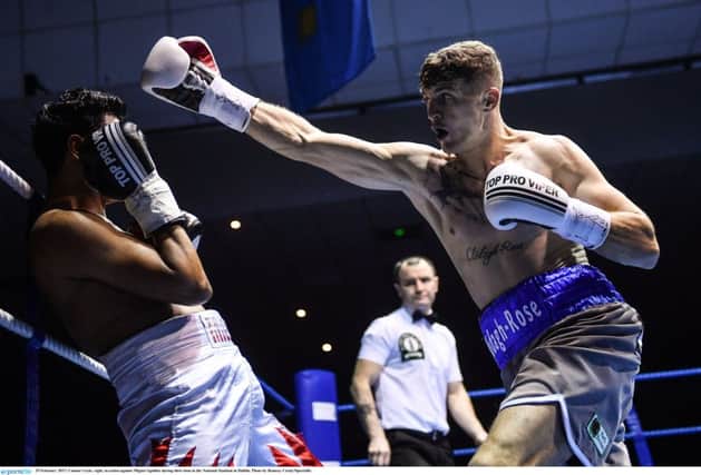 Connor Coyle, right, in action against Miguel Aguillar during their bout in the National Stadium in Dublin. Photo by Ramsey Cardy/Sportsfile