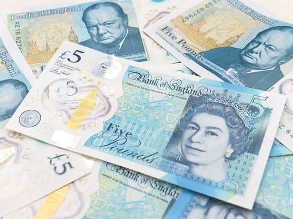 The new Bank of England Â£5 notes were introduced into circulation in September.