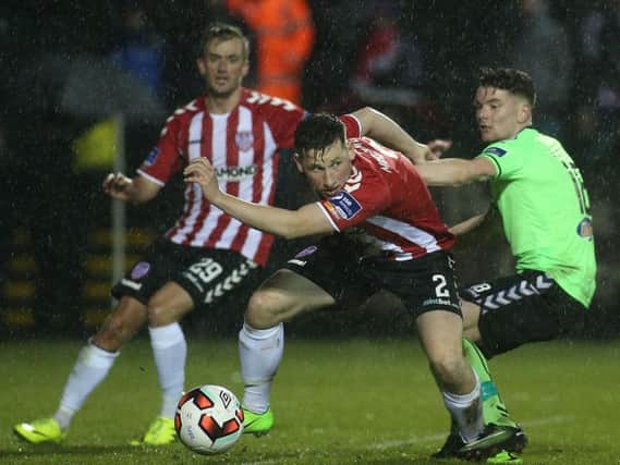 Derry's Conor McDermott and Limerick goalscorer, Dean Clarke pictured in action before the power failure at Maginn Park.