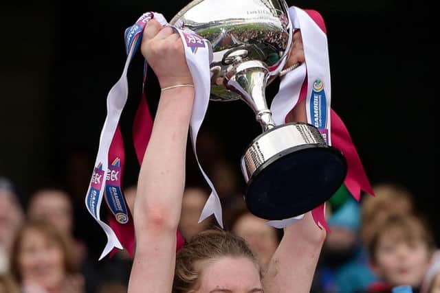 Aoife N Chaiside of Slaughtneil lifts the Bill & Agnes Carroll Cup following her side's victory during the AIB All-Ireland Senior Camogie Club Championship Final.