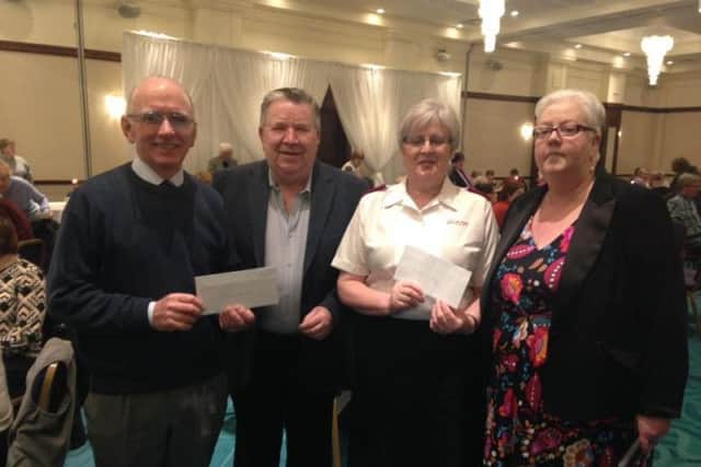 President Mary McCloskey and Past President Brian McMurray presenting cheques to Jim Herron of the St Vincent de Paul and Major Joan Archibald of the Salvation Army.