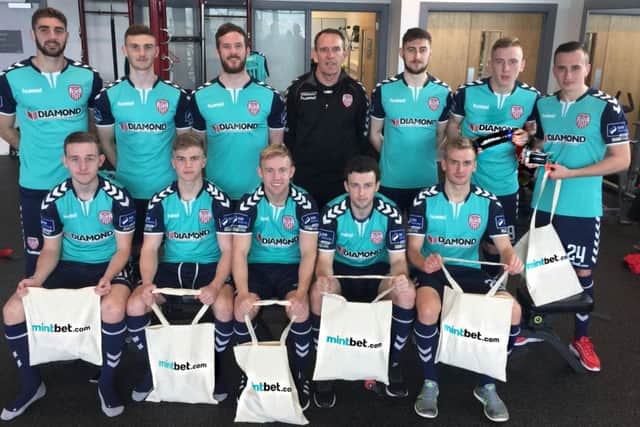 Derry City manager Kenny Shiels and his squad pictured at the launch of their new shorts sponsor Mintbet.