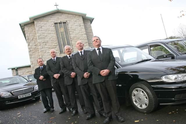 The late John Bradley (on left) with staff of Bradley and McLaughlins, Funeral Directors, William Street, Derry, outside St. Mary's in 2013.