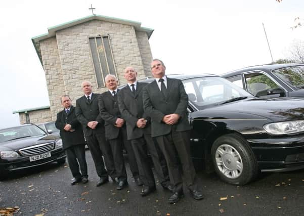 The late John Bradley (on left) with staff of Bradley and McLaughlins, Funeral Directors, William Street, Derry, outside St. Mary's in 2013.