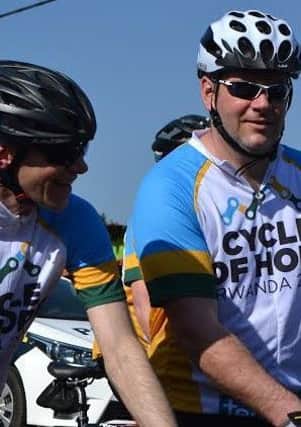 Local cyclists Chris McElwee and Paul Linkens pictured during the cycle in Rwanda.