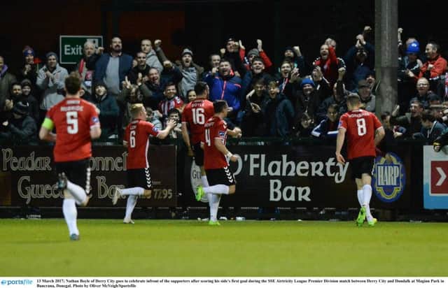 TWELTH MAN . . . Nathan Boyle of Derry City goes to celebrate infront of the supporters after scoring his side's first goal during the victory over Dundalk at Maginn Park.