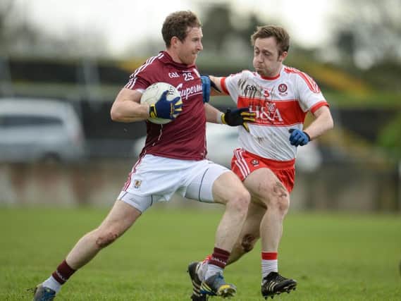 Galway's Gary Sice takes on Neil Forester during the Allianz Football League Division 2 match at St. Jarlaths Park in Tuam.