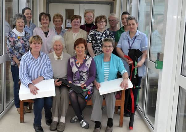 Friends of Waterside Hospital Fundraising committee pictured with nursing staff recently at the presentation of specialized equipment including moving and handling belts and bath steps. DER1117GS011