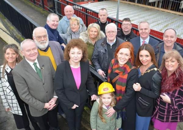 Martin McGuinness along with Caral Ni Chuilin, former Mayor Elisha McCallion, Maeve McLaughlin, Martina Anderson and members of the Bloody Sunday Trust at the site of the Free Derry Museum.