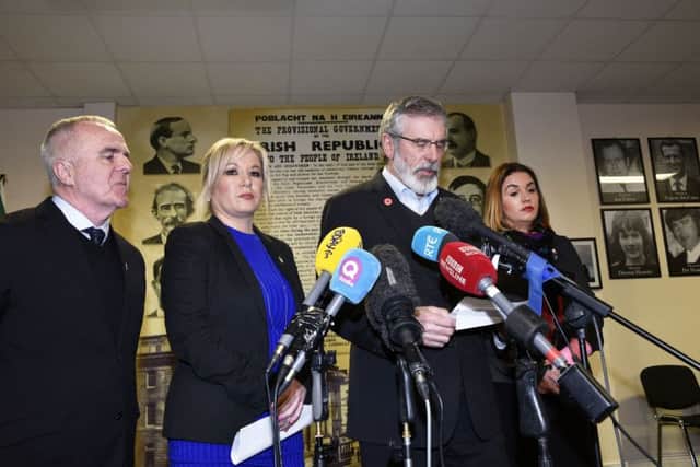 Sinn Fein president Gerry Adams speaking at yesterday's press conference flanked by party leader Michelle O'Neill and Foyle MLA's Raymond McCartney and Elisha McCallion. DER1217-133KM