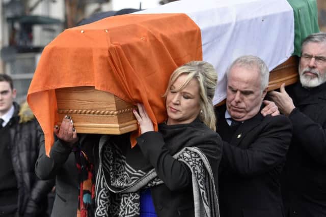 Party leader Michelle O'Neill carries the coffin of Martin McGuinness. DER1217-145KM