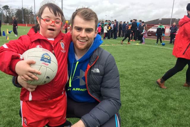 Derry goalkeeper Conor McLarnon with Sorcha Moran from Dersertmartin  at the GAA for All event at Owenbeg last Saturday.