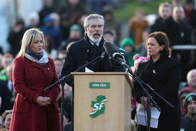 Sinn Fein's Michelle O'Neill, Gerry Adams and Mary Lou McDonald at Derry City Cemetery.