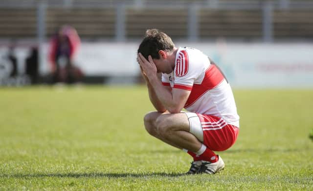 A frustrated Benny Herron holds his head in his hands at the final whistle.
(Photo Lorcan Doherty / Presseye.com)
