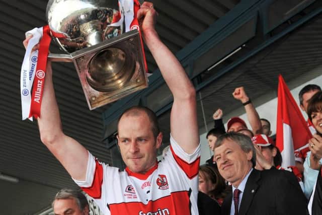 Kevin McCloy lifts the National League title in 2008