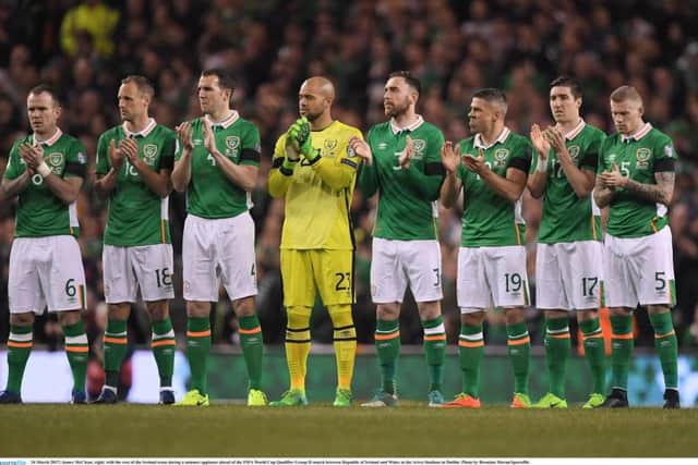 James McClean, right, with the rest of the Ireland team during a minutes applause ahead of the FIFA World Cup Qualifier Group D match between Republic of Ireland and Wales at the Aviva Stadium in Dublin.
