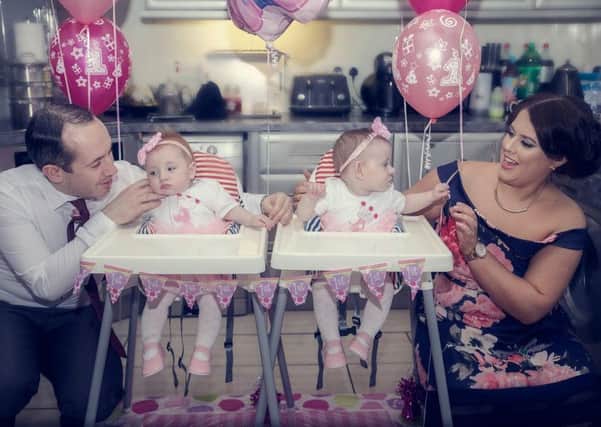 Ava (left) and Amelia celebrating their first birthday with parents Garvin and Emma Harkin. (Picture By Miss Mels Photography)