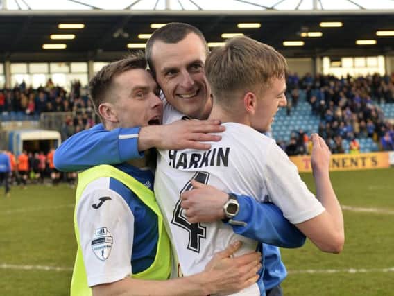 Coleraine's Ciaron Harkin celebrates with manager Oran Kearney after their Irish Cup semi-final win over Glenavon.