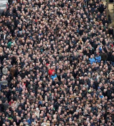 Crowds follow as the coffin of Martin McGuinness is carried down Westland Street into the Bogside ahead of his funeral at St Columba's Church Long Tower.