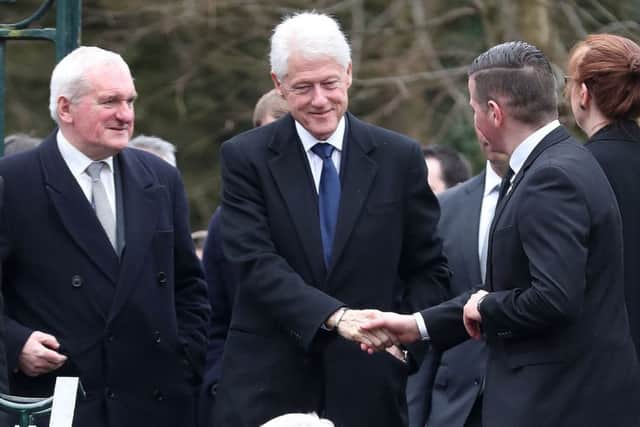 Former US President Bill Clinton arriving for the funeral of Martin McGuinness.