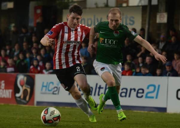 Cork City's Stephen Dooley tries to skip away from Derry City's Conor McDermott, during Friday night's game at Turners' Cross. Picture by EÃ³in Noonan/Sportsfile
