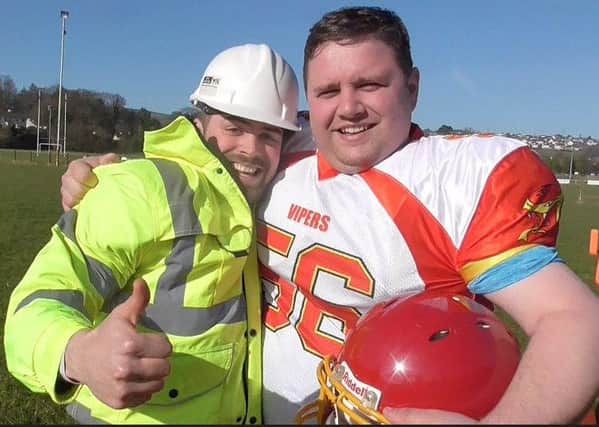 Trading places . . . Isaac Sullivan, Vipers' Safety and Darren Donaghy of Donaghy Safety Training exchange workwear for cameras.