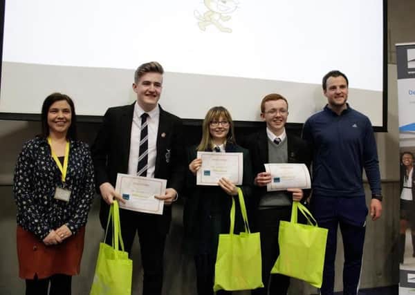 Pictured at the recent uCode17 computer programming competition in Letterkenny Institute of Technology are the Category Two (over-14) First Prize winners from St Cecilias College and St Josephs, Derry.  Leanne McFeeley, Ciaran Norris and Ryan McKeever are pictured with Michael Murphy, Captain of the Donegal GAA team, and their teacher, Claire Mc Dermott.