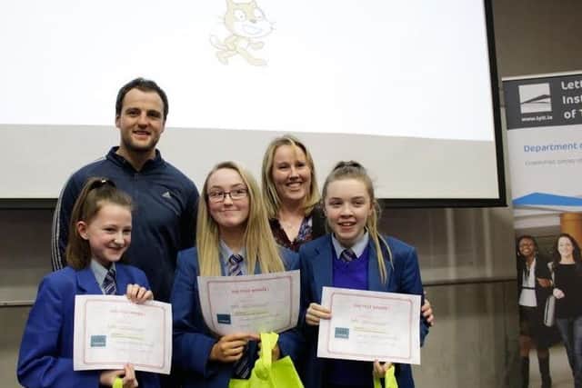 Pictured at the recent uCode17 computer programming competition in Letterkenny Institute of Technology are the Category One (under-14) Second Prize winners from St Marys College, Derry.  Grace Canning, Summer Cassidy and Ellie Holt are pictured with Michael Murphy, Captain of the Donegal GAA team, and their teacher, Caroline Rogan.