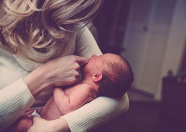 The coroner said "the public must know about the dangers of holding babies in this way".