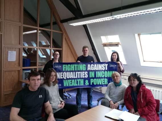 Sitting l-r: Union representative Niall McCarroll, Sinead Millar, Rainbow Rehoming Centre,Caroline Gillespie (Unison) and Anna Roe (First Housing Support Worker). Back: Kathleen Bradley and Shaun Harkin (Unison) and Rosemary Bradley (First Housing Floating Support Worker).