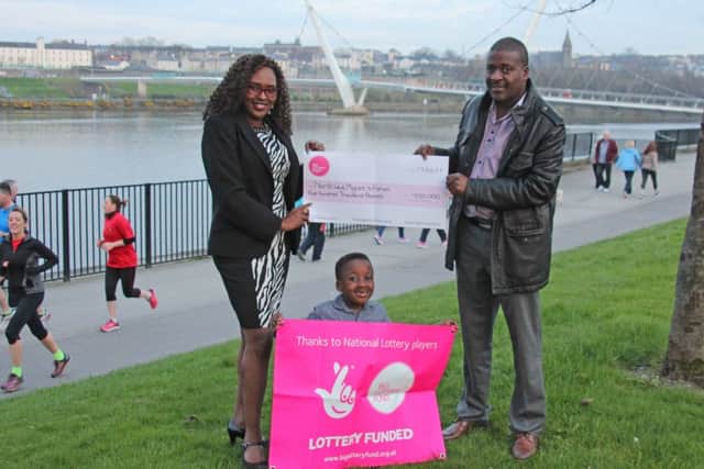 Lillian Seenoi, projects director, with Tshamano Mushapho, chairman of North West Migrants Forum pictured recently after receving a funding boost from Big Lottery.
