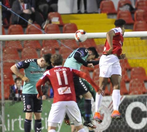 Derry defenders, Aaron Barry and Conor McDermott challenge Sligo striker, Jonah Ayunga during the 1-1 draw at the Showgrounds.