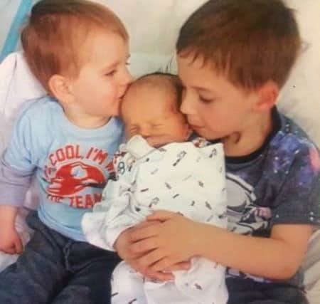 Noah with his brothers, Jamie and Lucas.