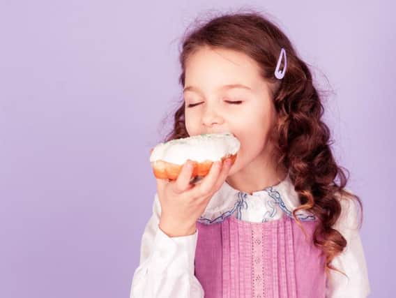 Children aged four to six handed treats to quieten them down were more likely to rely on comfort food high in calories as they approach their teenage years.
