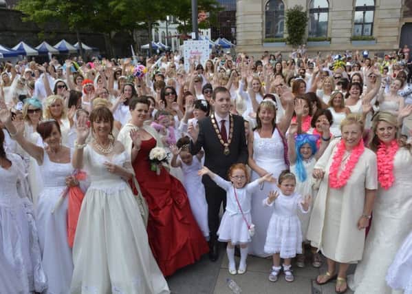 The then Deputy Mayor, Councillor Gary Middleton pictured amongst the participants before the start of the Foyle Hospice Brides Across the Bridge event back in 2014. INLS2714-108KM