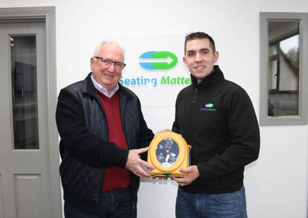 James McGuinness from HeartSine and  Ryan Tierney with the defibrillator.