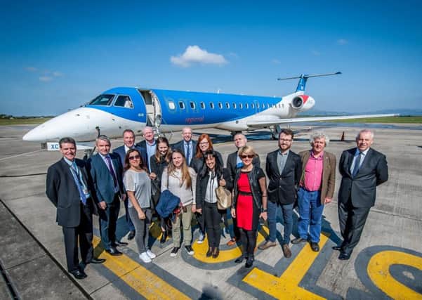 Ciaran Doherty, Tourism Ireland (back row 4th right); Ian Woodley, BMI Regional (back row 4th left); Roy Devine, City of Derry Airport (back row 3rd left) and Odhran Dunne, Visit Derry (back row 2nd left) with GB journalists who arrived at the City of Derry airport on the inaugural BMI Regional London Stansted flight. Pic by Stephen Latimer.