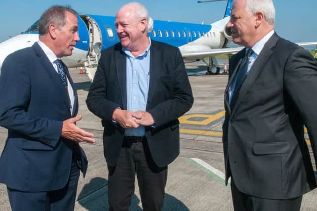 Roy Devine, left,  Chairman of City of Derry Airport and Derry City and Strabane District Council Chief Executive John Kelpie, right, pictured with BMI Regional board member Ian Woodley, centre following the arrival of the first flight from London Stanstead to City of Derry airport. Picture Martin McKeown. Inpresspics.com. 02.05.17